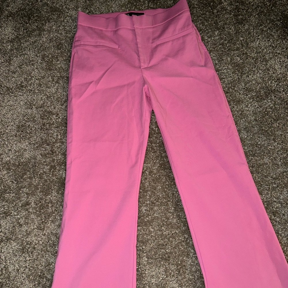 Pink flared pants.